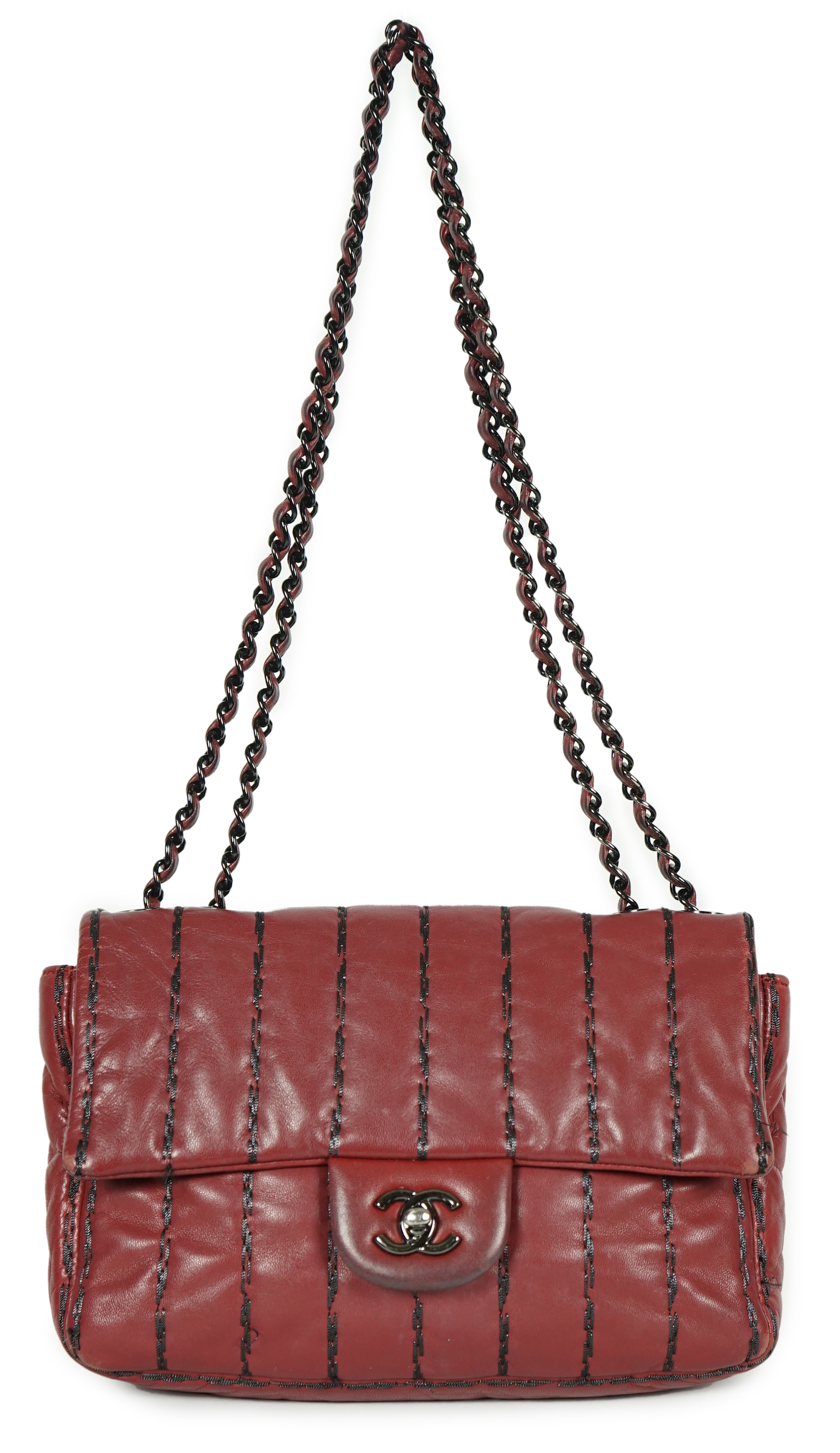 A Chanel Classic Jumbo Flap burgundy lambskin quilted shoulder bag, with pinstripe stitching, width 25cm, height 18cm, overall height 48cm, depth 6cm, Please note this lot attracts an additional import tax of 20% on the